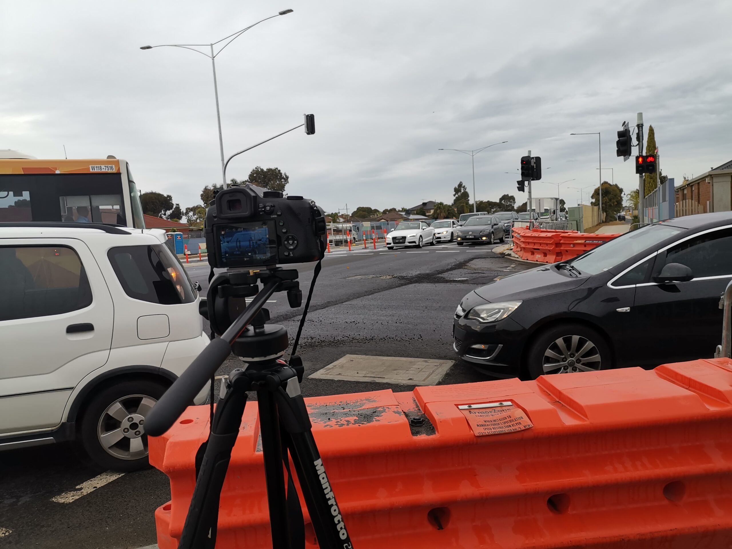 Behind the camera view from filming on the side of the road
