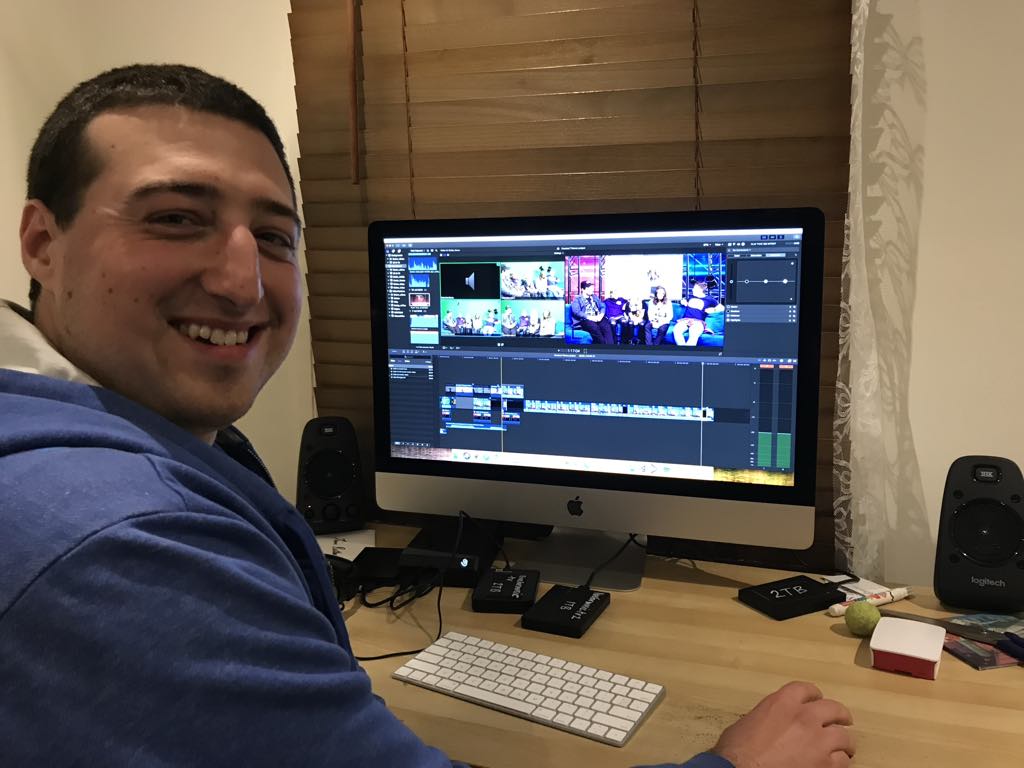 Me smiling at the camera while editing an episode of live for music
