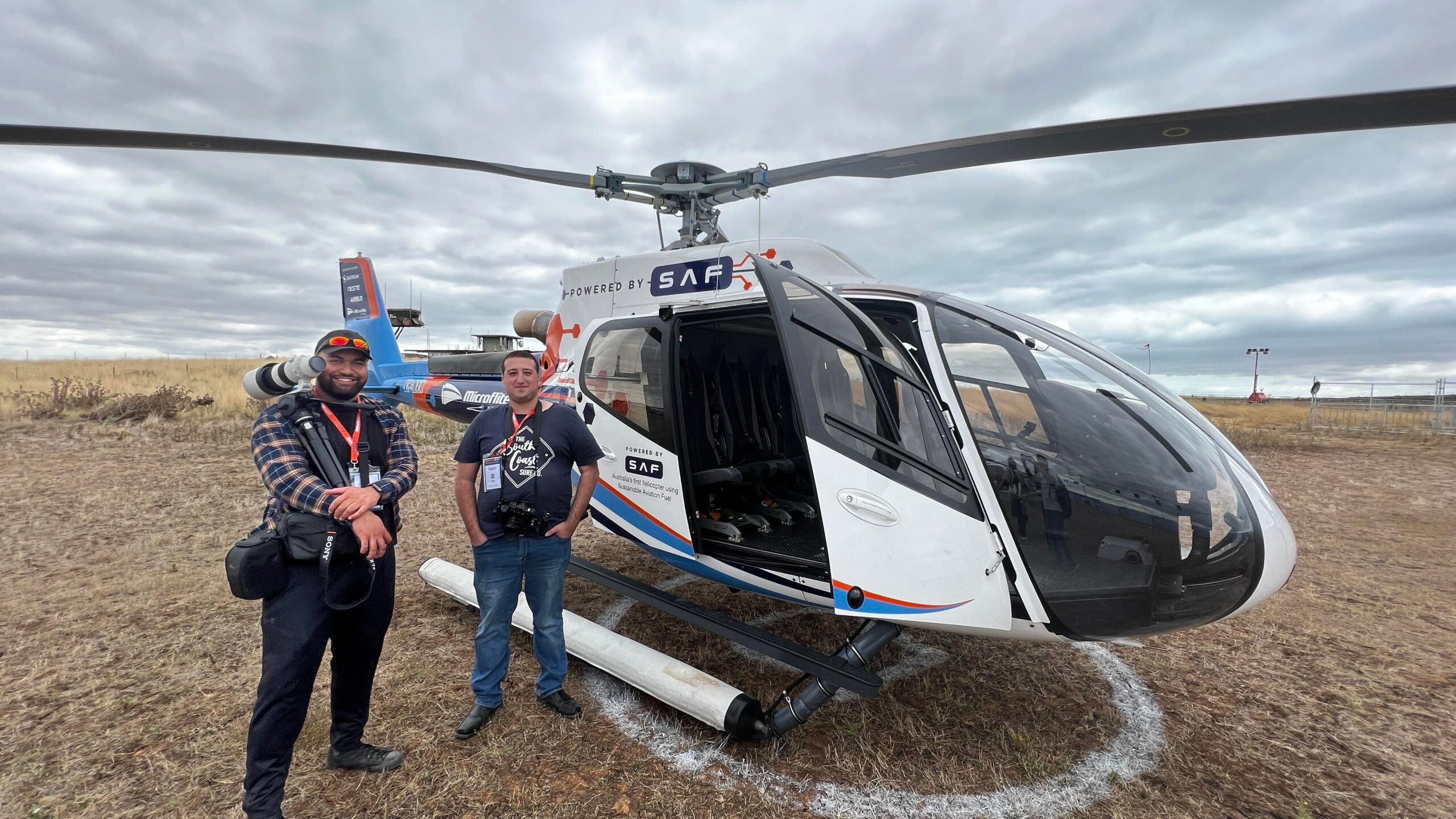 Myself and another camera person getting ready to board a helicopter for our filming shoot
